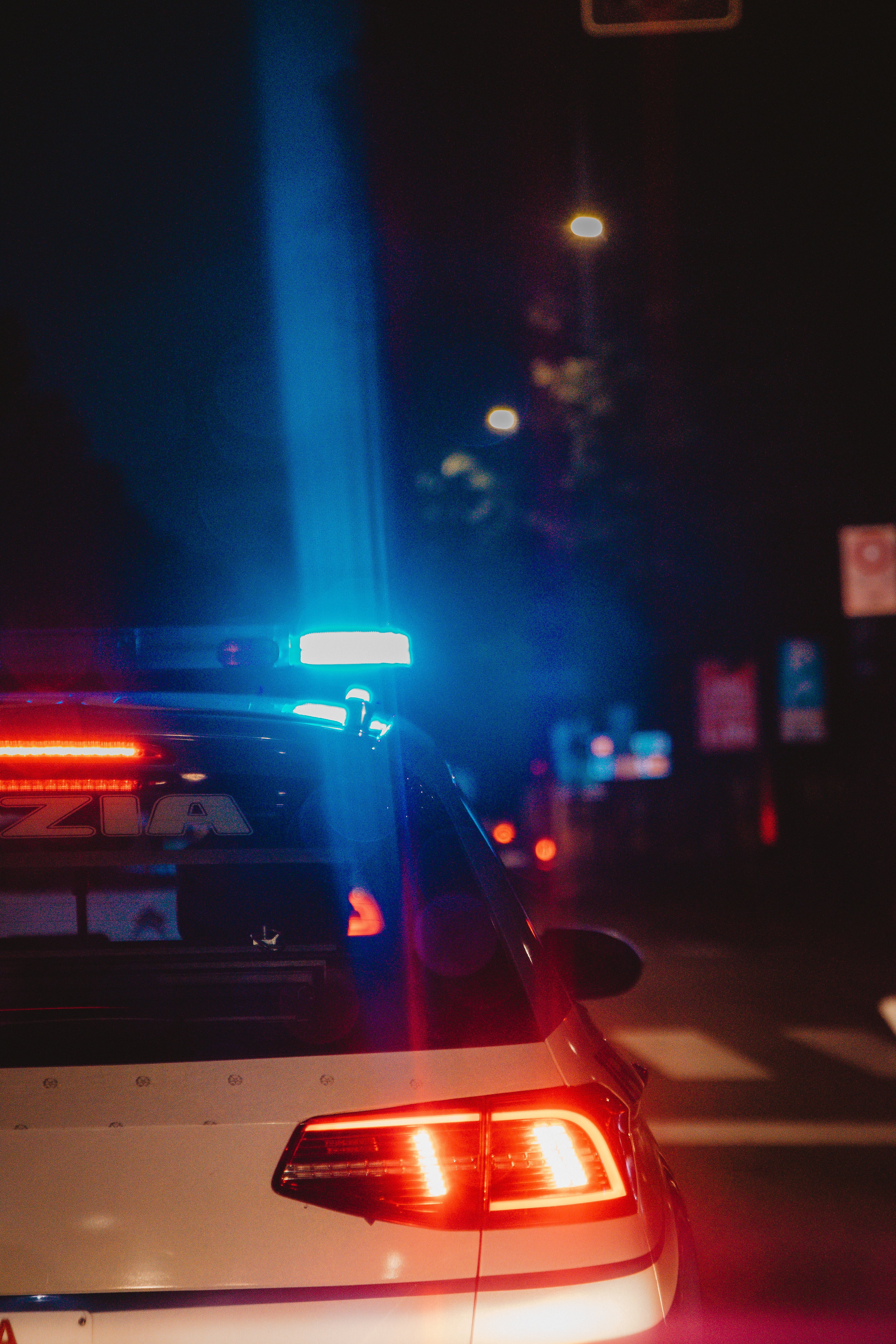 police car with lights on at night